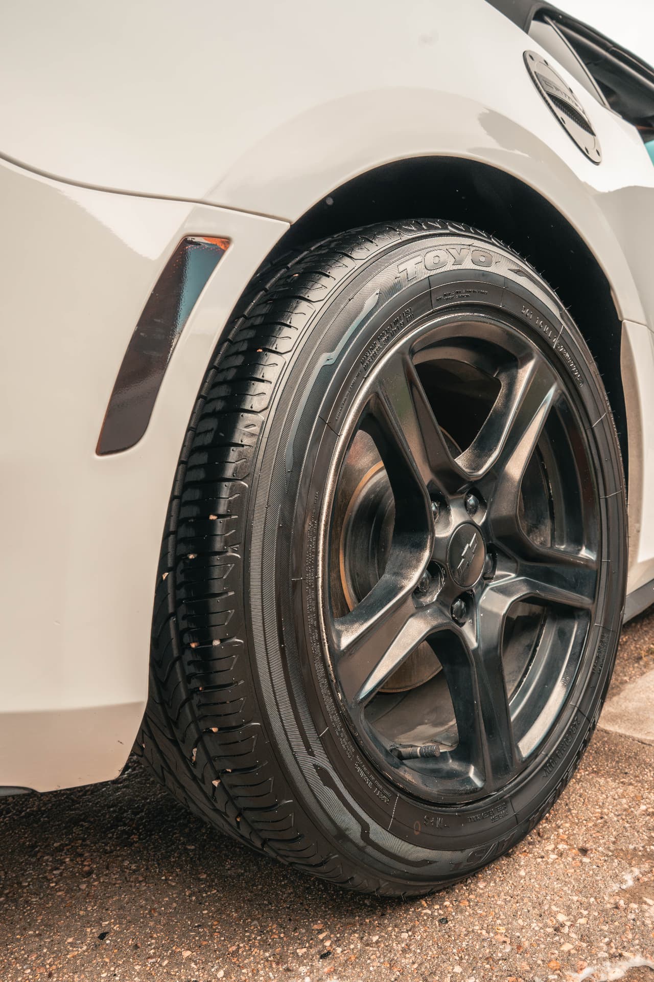 Clean gunmetal Camaro wheel and dressed Toyo tire