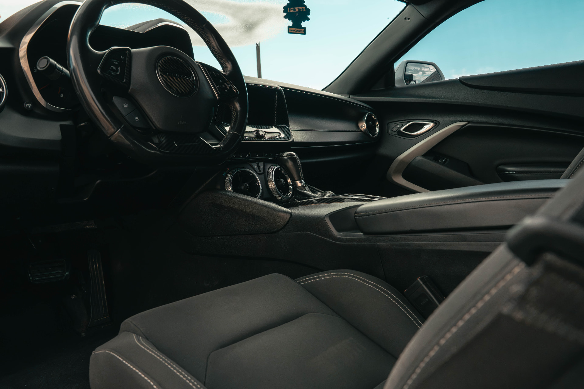 Spotless black Camaro interior with clean dash, console and seats